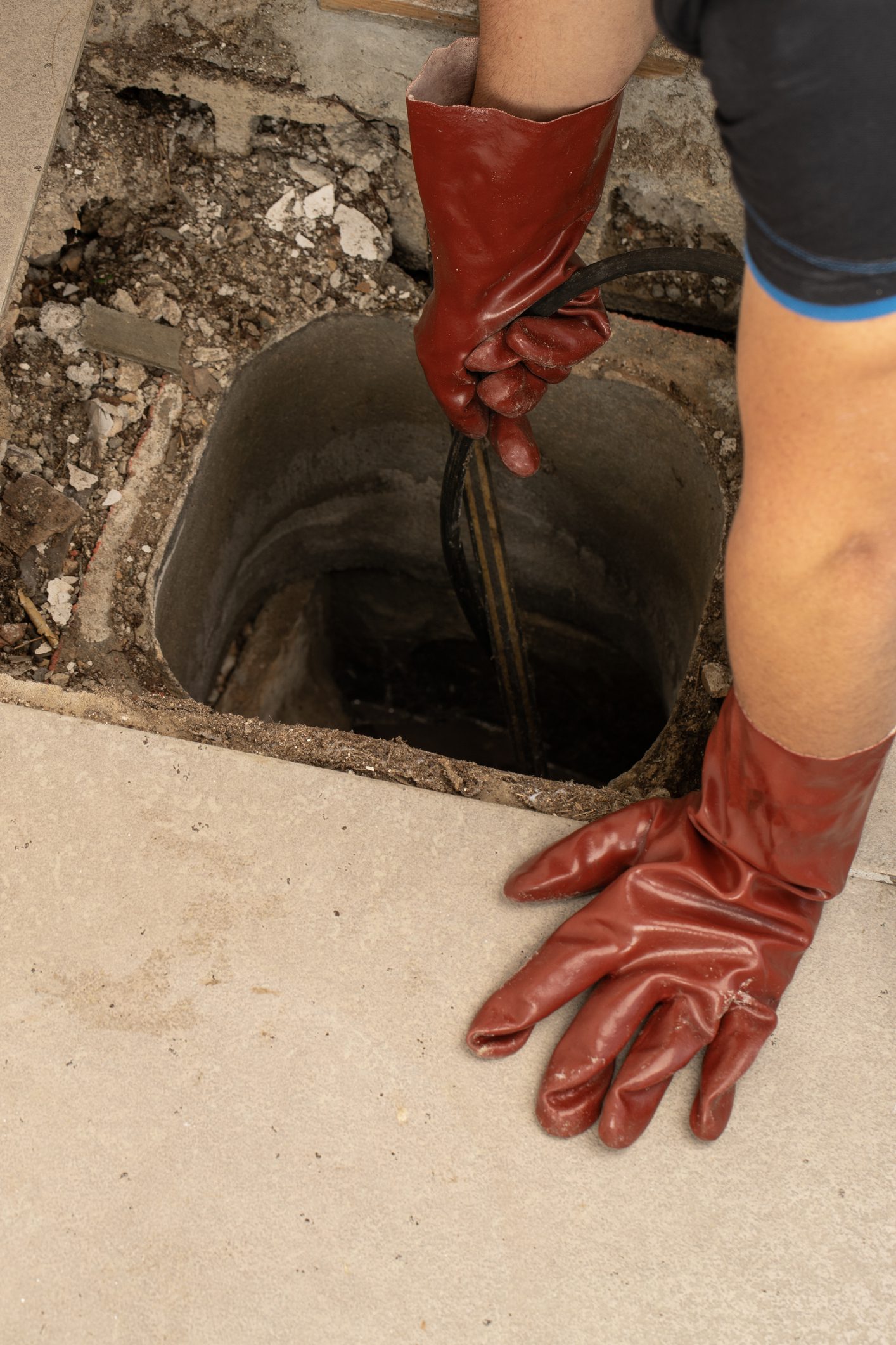 The Comprehensive Drain Cleaning Process Involves Essential Tools and Protective Gloves The Comprehensive Drain Cleaning Process Involves Essential Tools and Protective Gloves
